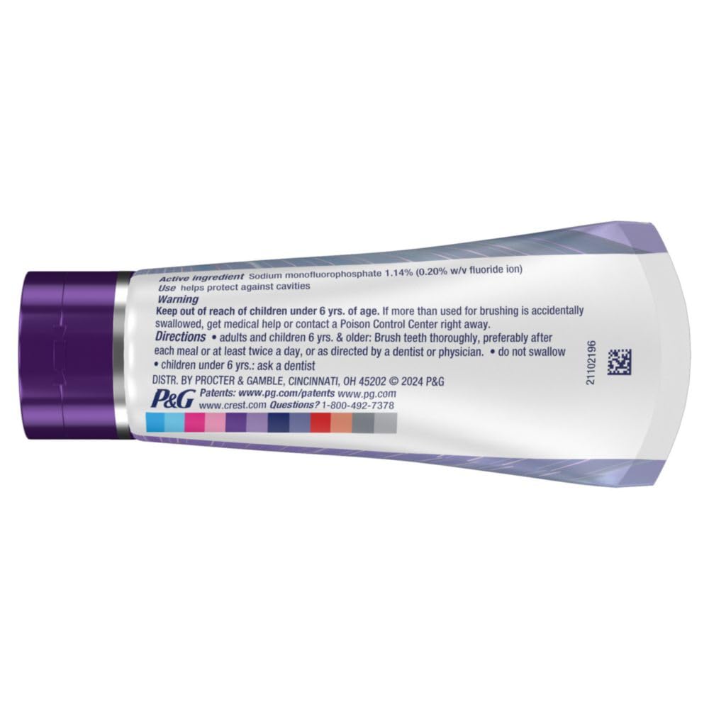 Crest toothpaste tube with label on a white background
